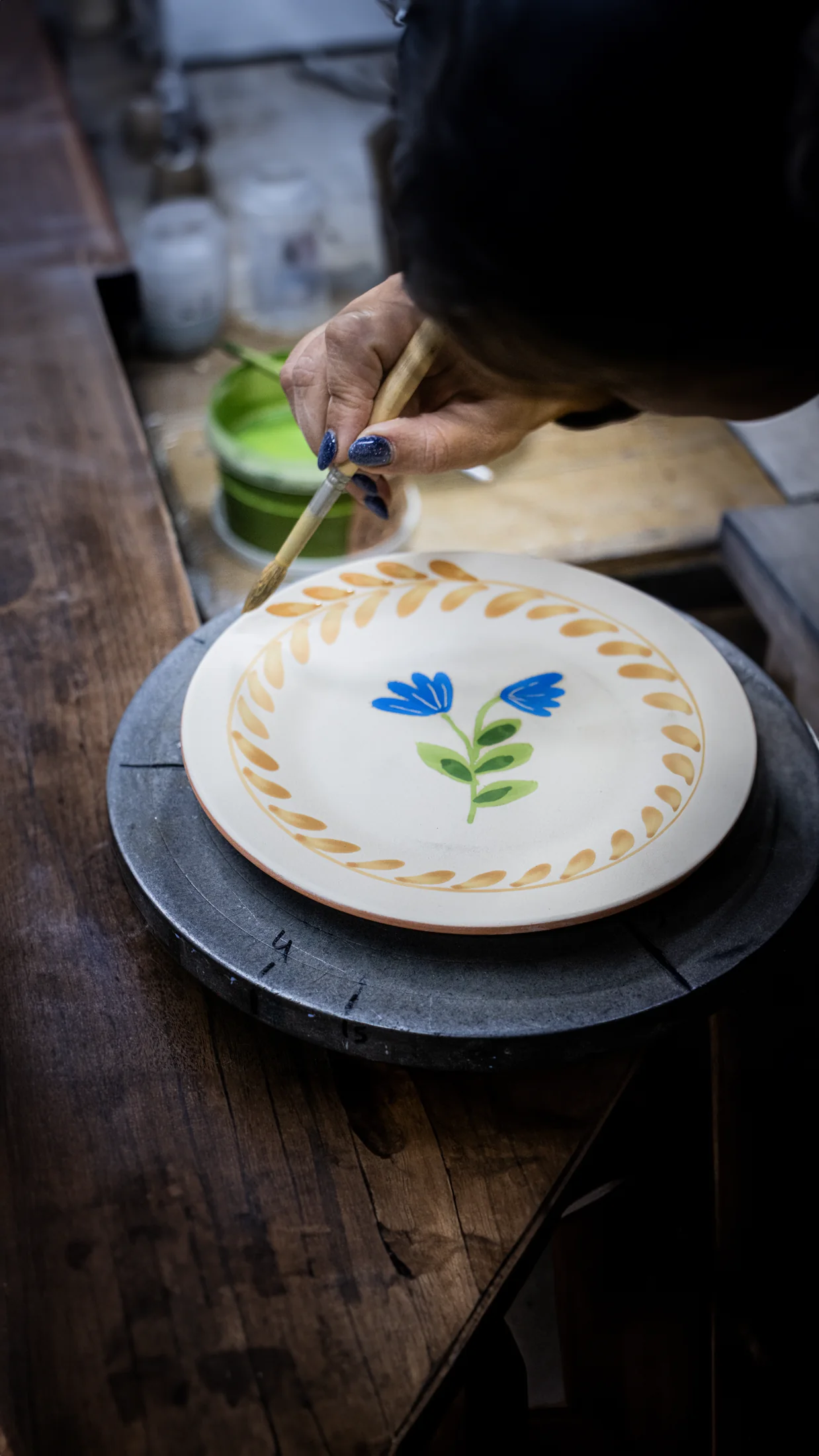 A Maria Portugal Terracota table setting with scalloped plates